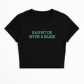 BAD B*TCH WITH A BLICK BABY TEE (GREEN FONT)