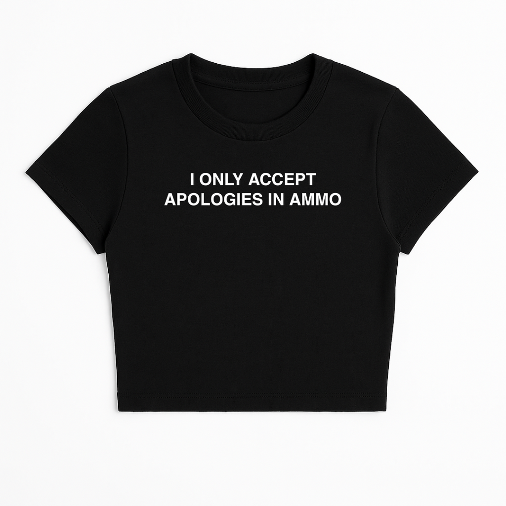 I ONLY ACCEPT APOLOGIES IN AMMO BABY TEE (MONOCHROME)
