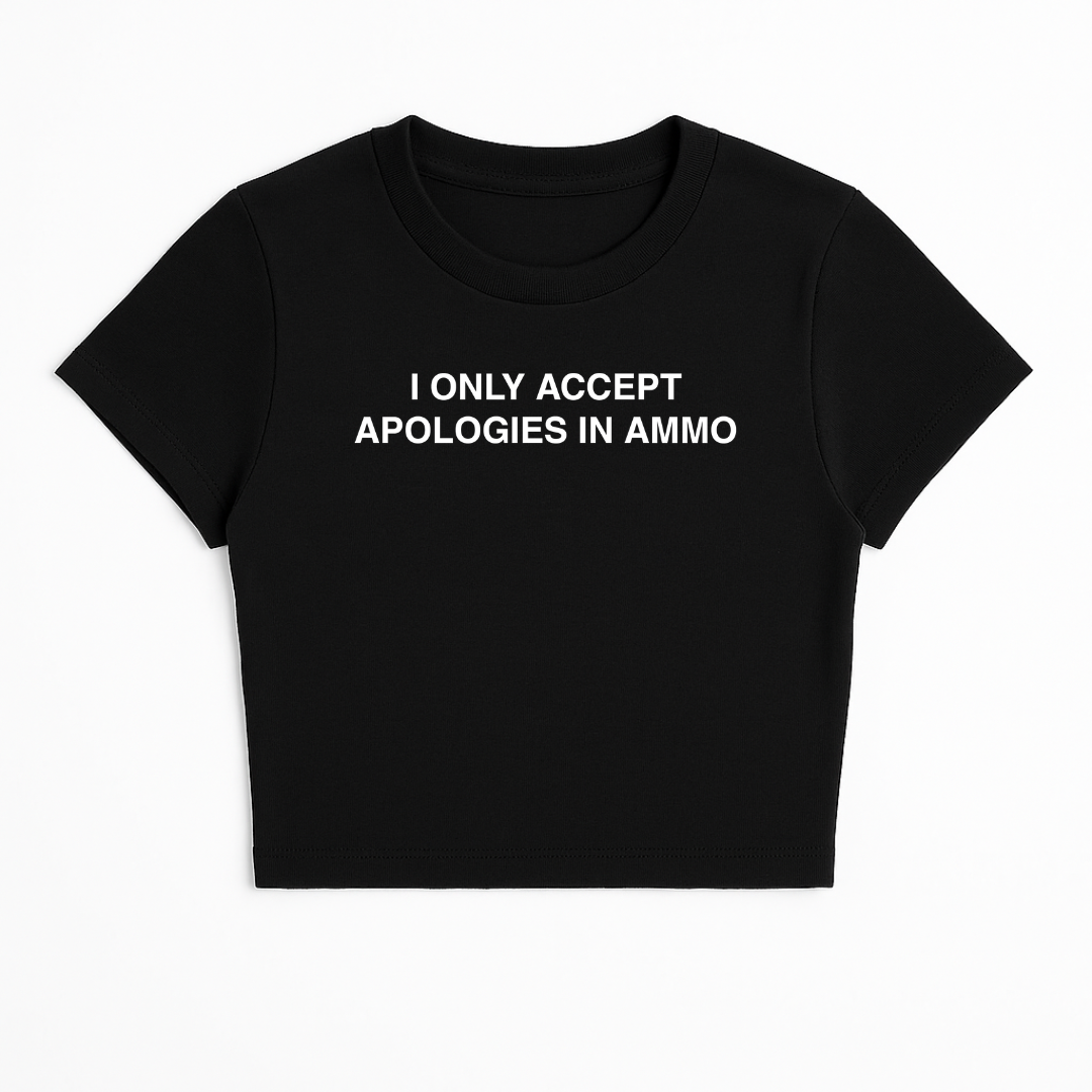 I ONLY ACCEPT APOLOGIES IN AMMO BABY TEE (MONOCHROME)
