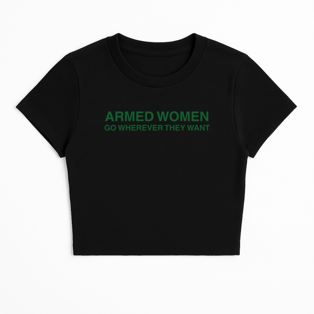 ARMED WOMEN CAN GO WHEREVER THEY WANT BABY TEE (GREEN FONT)