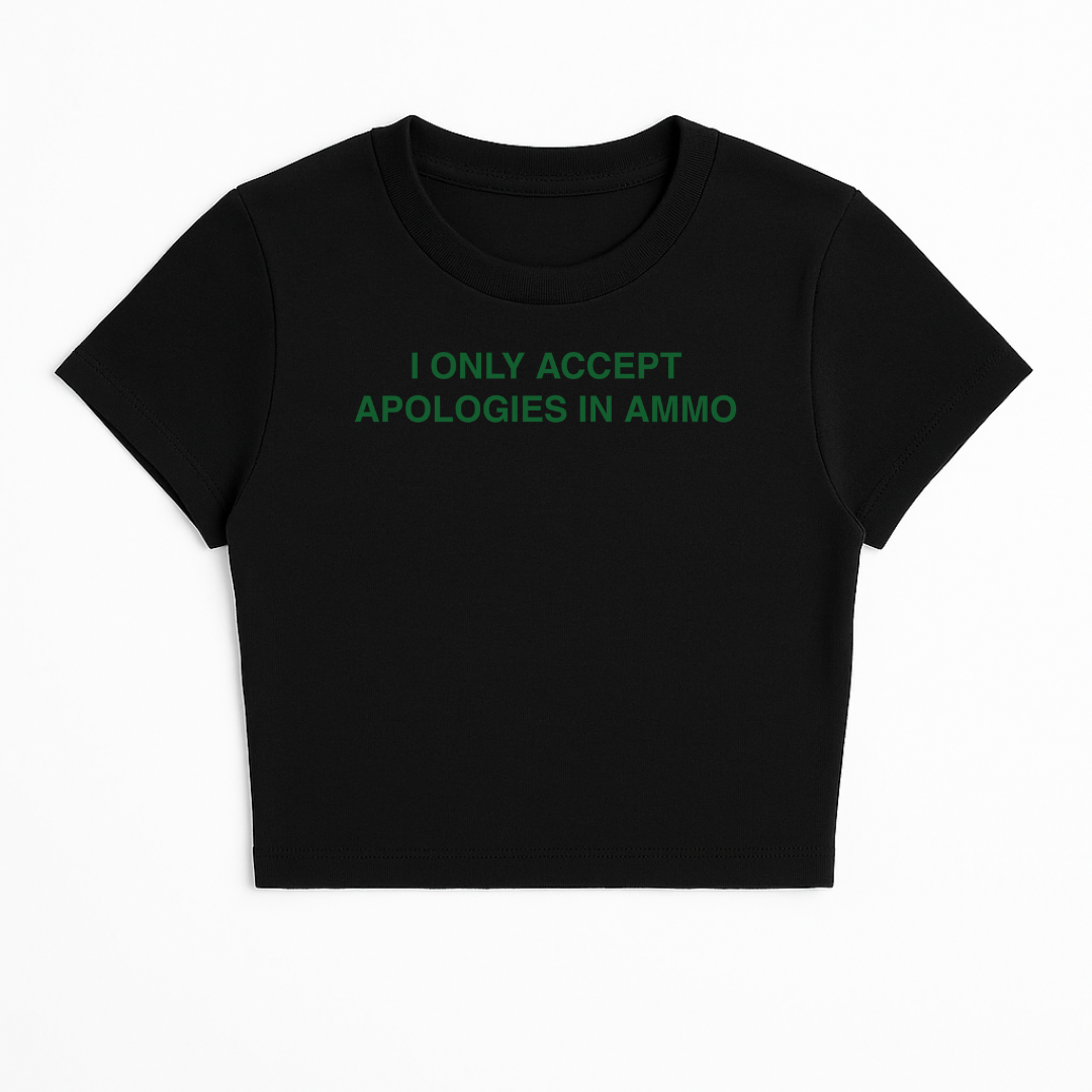 I ONLY ACCEPT APOLOGIES IN AMMO BABY TEE (GREEN FONT)