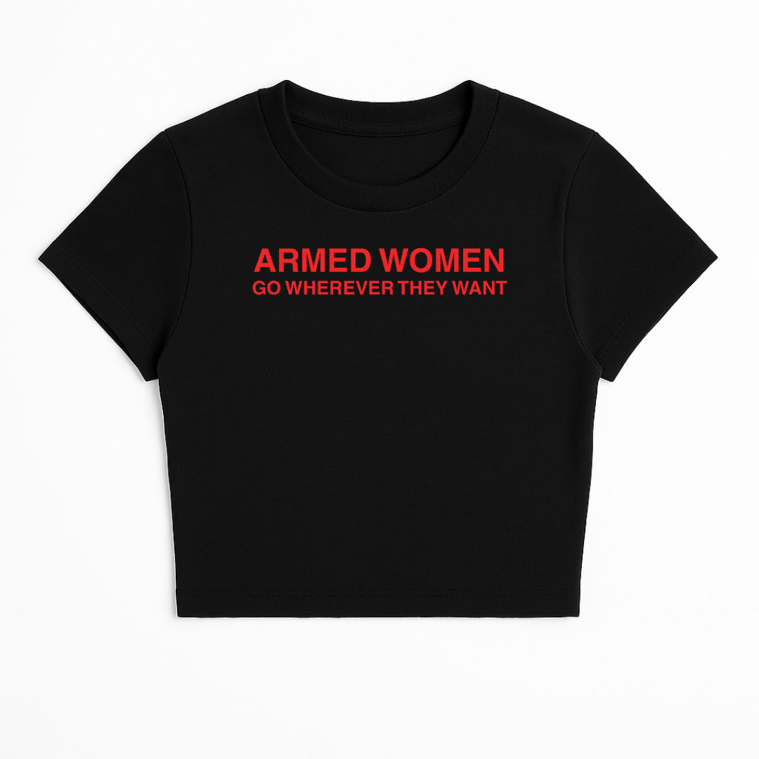 ARMED WOMEN GO WHEREVER THEY WANT BABY TEE (RED FONT)