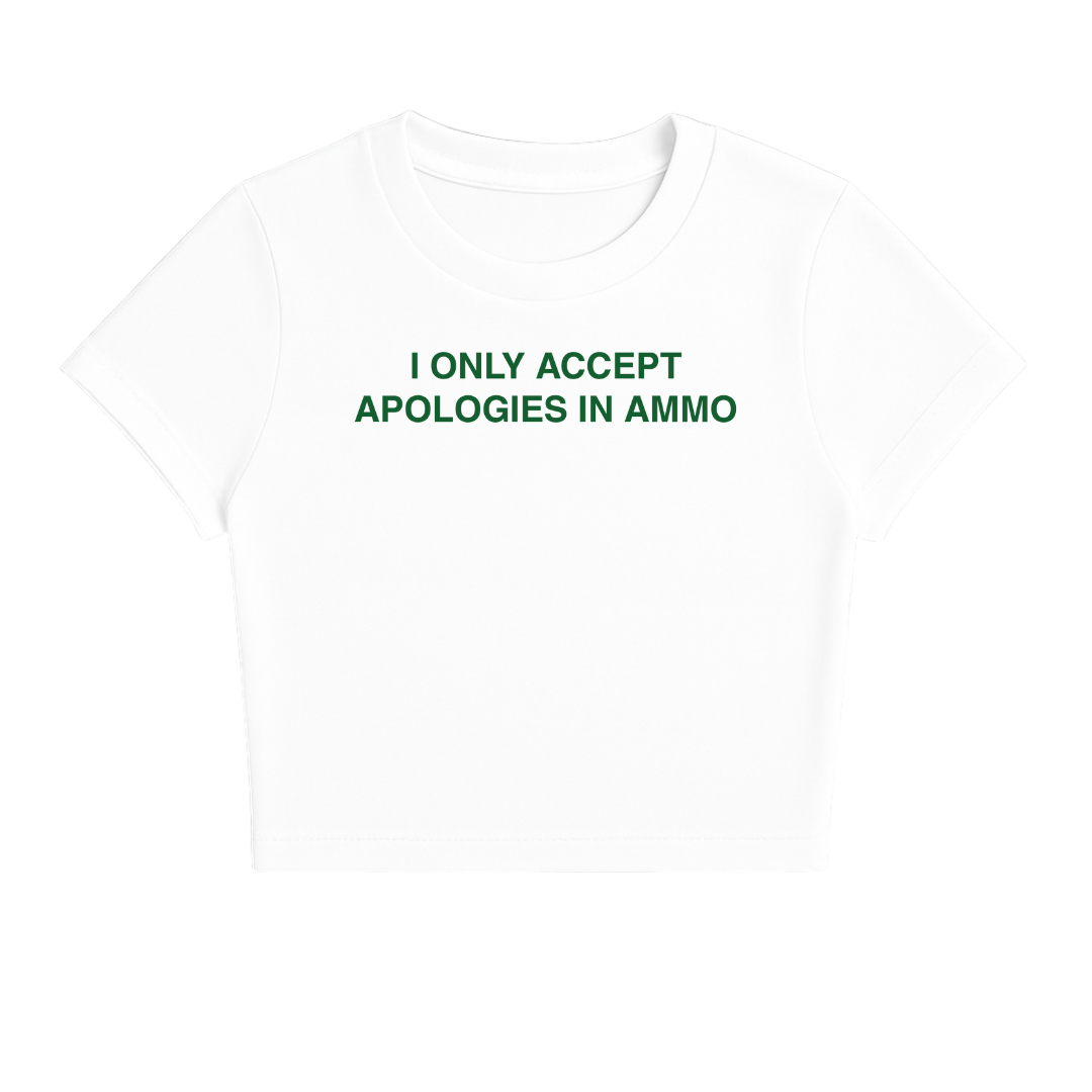 I ONLY ACCEPT APOLOGIES IN AMMO BABY TEE (GREEN FONT)